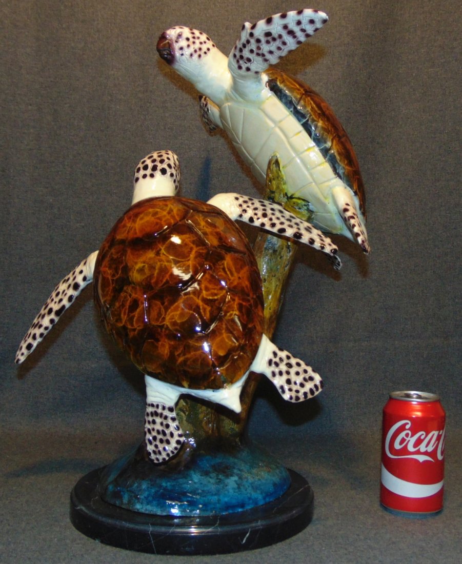 Bronze Double Sea Turtle Sculpture on Marble Base: Multi color Bronze Double Sea Turtle Sculpture on a Black Marble Base. Artist Signed and numbered edition 15 of 50. Measures 20-1/2. Condition is very good. No Damage at all. This Sculpture is made en