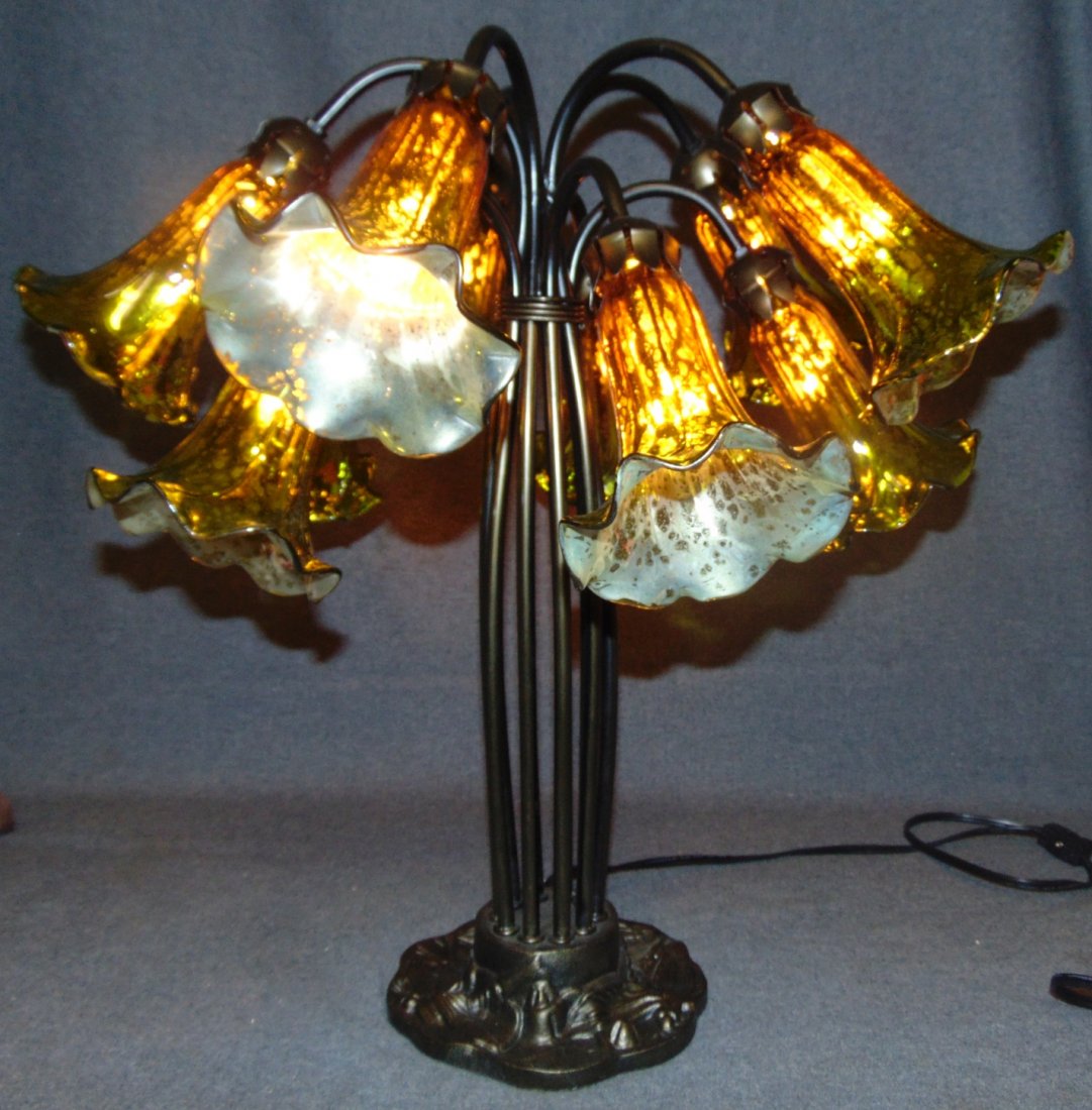 10 Light Lily Table Lamp: 10 Light Lily Table Lamp. Measures 21" tall x 21" wide. Overall condition is Excellent. No Damage. Several Shipping Options Available. Starting Bid $50. Auction Estimate $120 - $150.