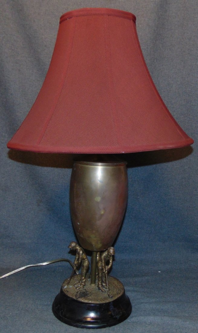 PGA Golf Home Golfer Brass Urn Trophy Table Lamp: PGA Golf Tour Home Golfer Brass Urn Trophy Table Lamp with Shade. Measures 30" tall x 17" wide. Overall condition is fair to good with minor wear. Needs cleaning. Starting Bid $30. Auction Estimate $4