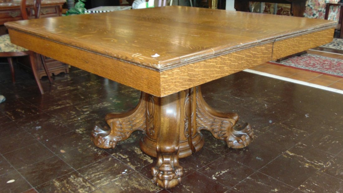Antique Golden Oak Pedestal Dining Table: Antique Golden Oak Pedestal Dining Table. Circa 19th Century. Measures 30" tall x 50" wide x 50" deep. Includes 4 leaves. Each are 12" wide. Overall condition is very good with minor wear. No damage.