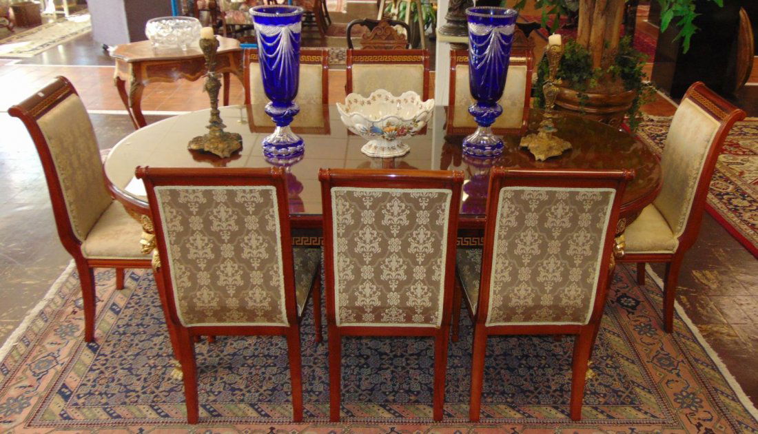 Elegant Versace Style Oval Dining Table: Versace Style Oval Dining Table with Bronze Mounts & Feet. Like New Condition. Beautiful Greek Key Design. Butterfly leaves recess inside when not in use. Measures 32" tall x 88" wide x 46" deep befor