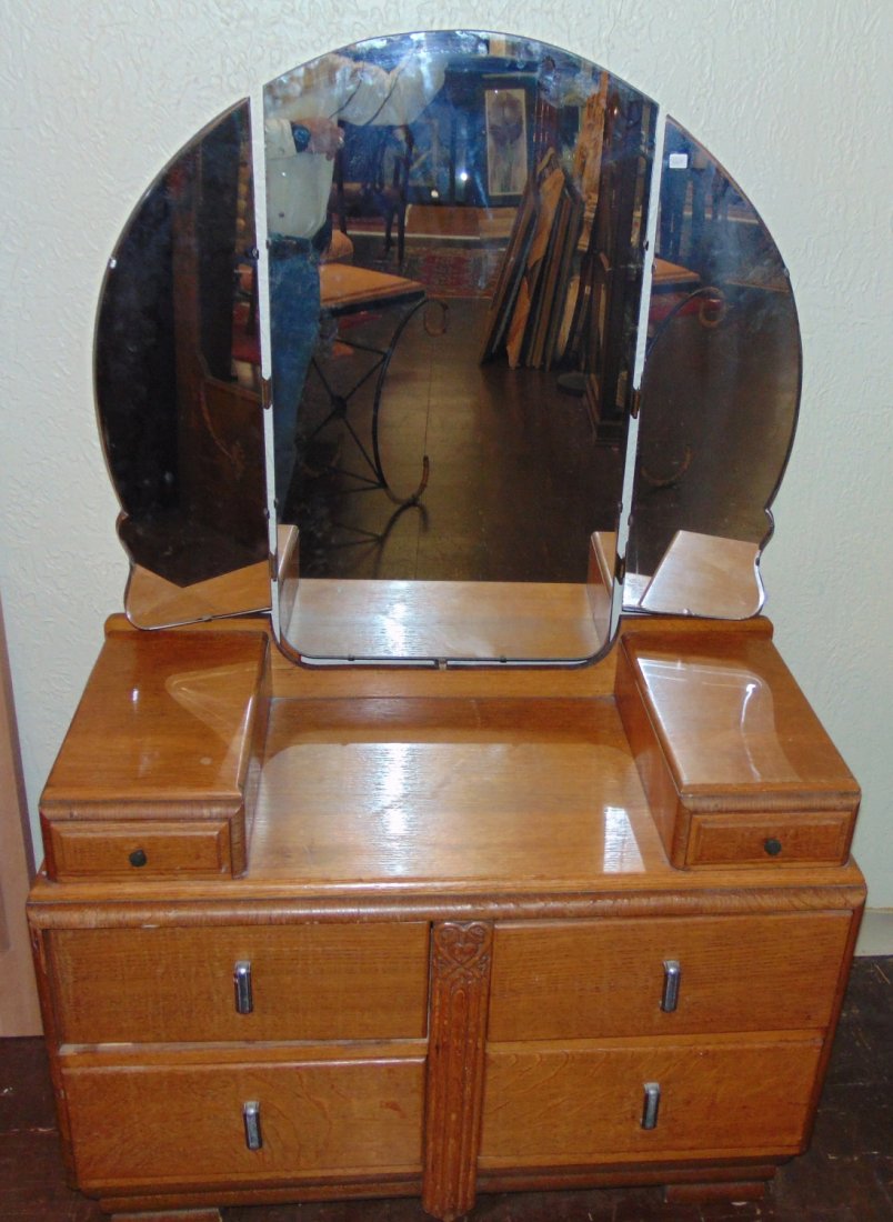 Vintage Art Deco Waterfall Oak Vanity Dresser: Vintage Art Deco Waterfall, Golden Oak Vanity Dressing Table with Original Tri-fold Mirror. 4 large drawers and 2 small upper drawers. Measures 62" tall x 41-1/2" wide X 20" deep. Condition is good wi