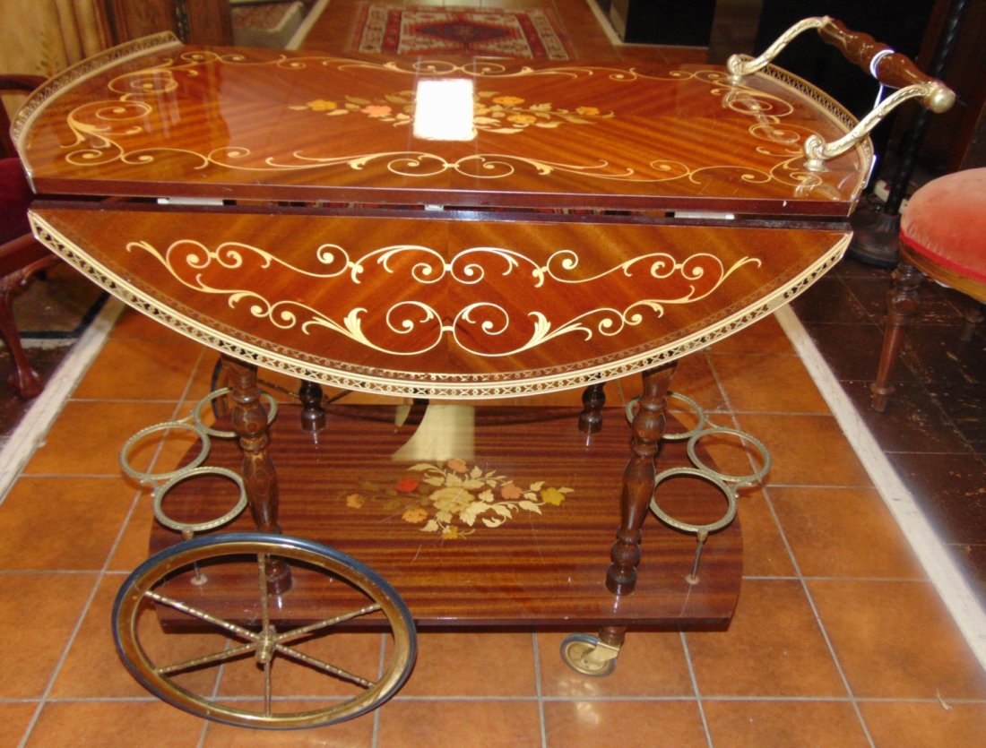 Italian Inlaid Drop Leaf Marquetry Wood Bar Cart: Italian Inlaid Drop Leaf Marquetry Wood Bar Cart. Measures 31" tall x 32" wide x 17-1/2" deep with leaves down. Leaves open up to a 30" round top. Condition is very good. No Damage. Several Shipping O