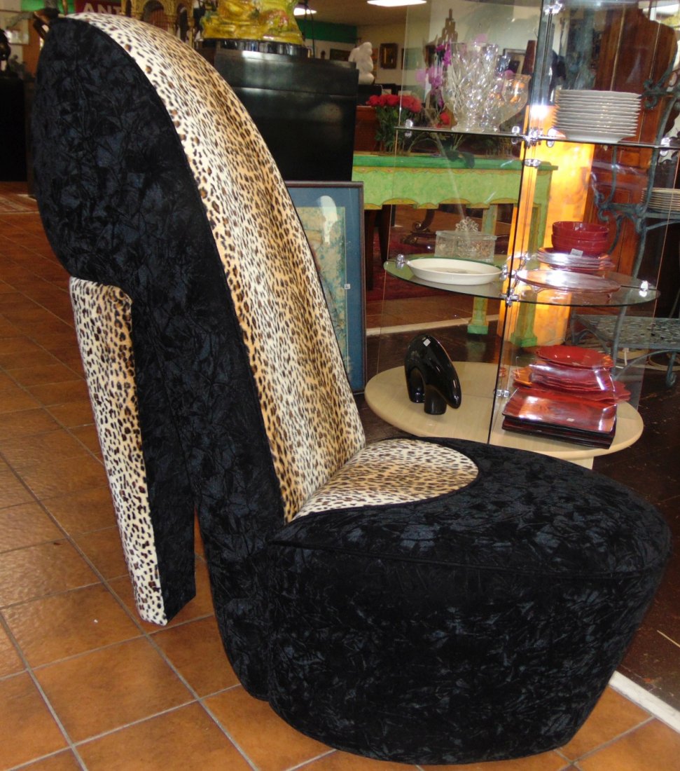 High Heel Shoe Shaped Chair: High Heel Shoe Shaped Upholstered Chair. Black Velvet and Leopard Print Velvet. Measures 40" tall x 21" wide x 42" deep. Condition is very good. No damage. Several Shipping Options Available. Starting