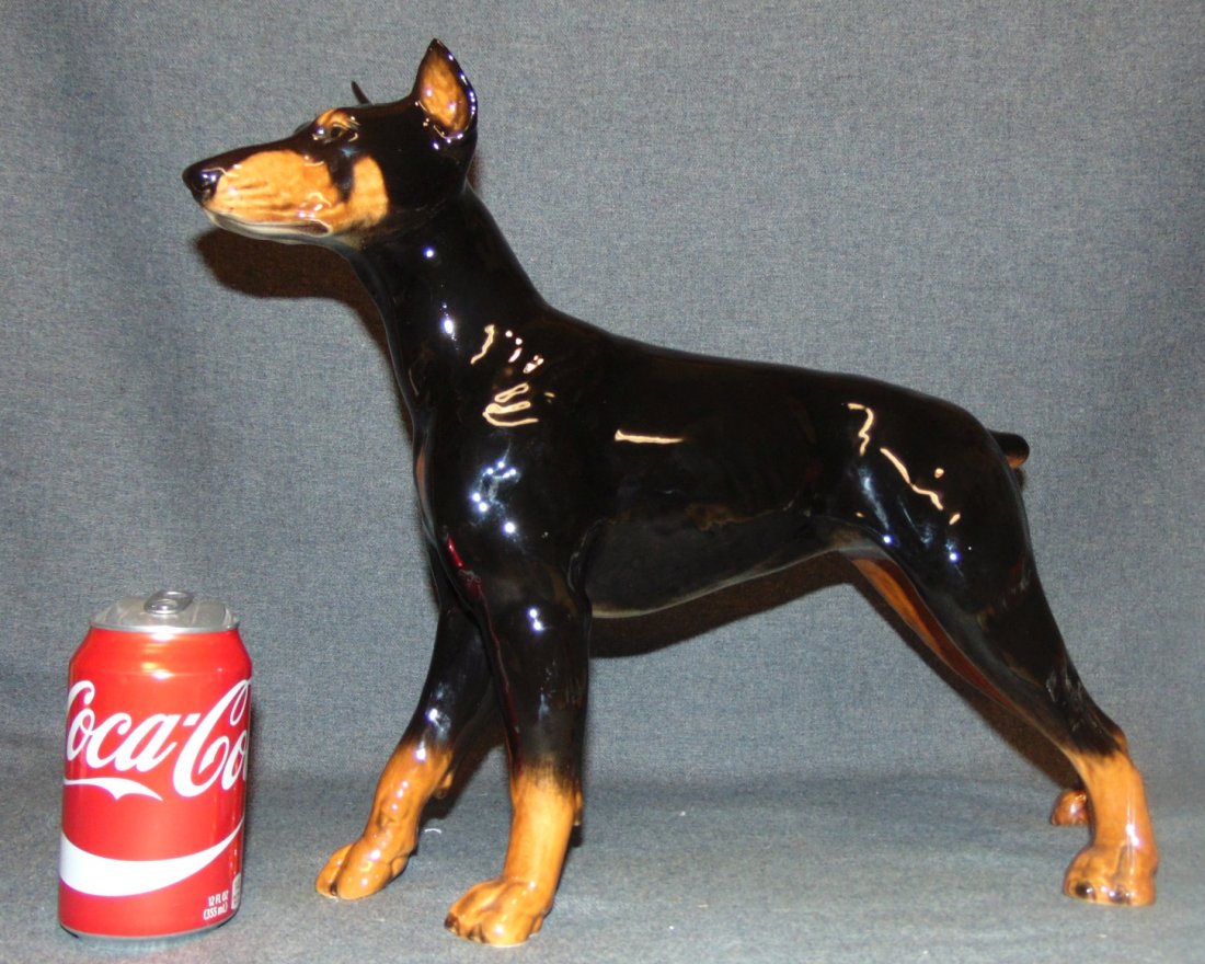 Large Goebel Porcelain Doberman Pinscher Dog Figurine: Large Goebel Porcelain Doberman Pinscher Dog Figurine. Measures 14" tall x 18" wide. Bottom is marked. Overall condition is Excellent. No Damage. Several Shipping Options Available. Starting Bid $50.