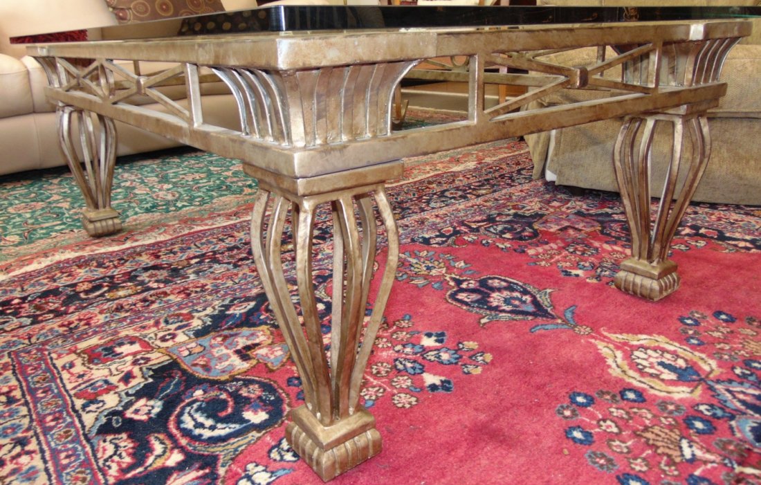 Large Wrought Iron and Glass Coffee Table: Large Wrought Iron and Glass Coffee Table. Very Heavy. Measures 21" tall x 54" wide x 38" deep. Condition is excellent to very good with minimal wear. No damage. Several Shipping Options Available.