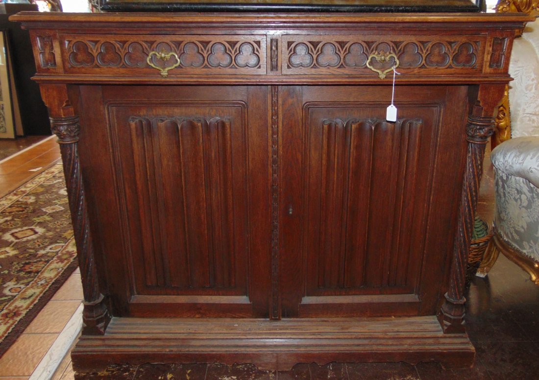 Antique Gothic Oak 2 Door Cabinet: Antique Gothic Oak 2 Door Cabinet. Circa 1900. Measures 43-1/2" tall x 51" wide x 18" deep. Overall condition is good. Wear consistent with age and use. Several Shipping Options Available.