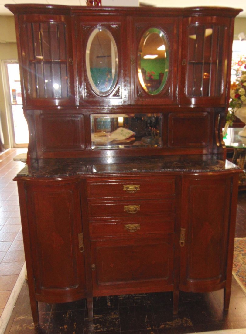 Art Deco Sideboard: Antique Inlaid Oak Sideboard Buffet with Marble Top. Circa 1940's. Original Beveled Glass Doors and Mirror with Display area on top. Lots of storage below on marble top base. Measures 75" tall x 52" w