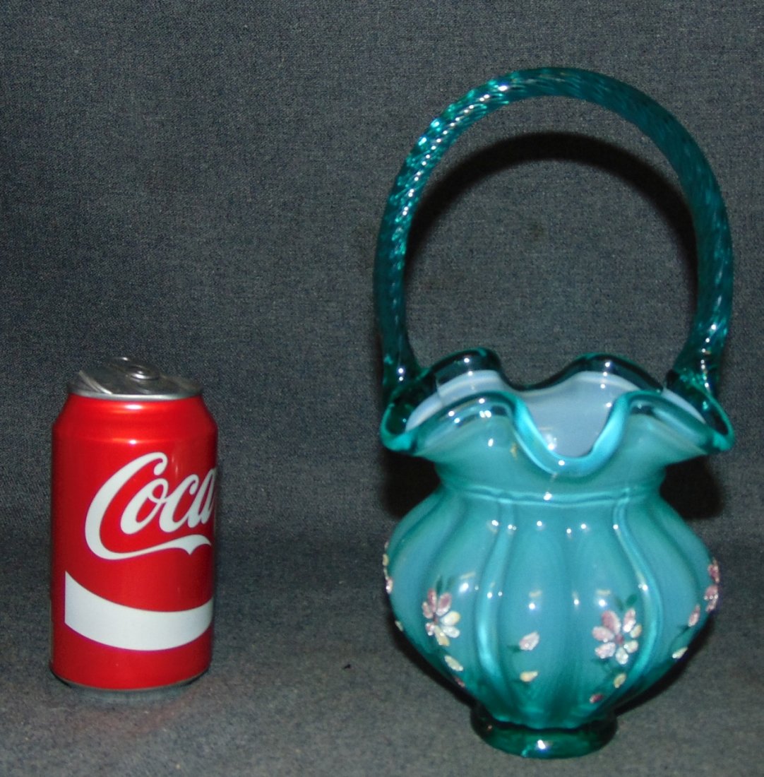 Fenton Hand Painted Signed Floral Basket: Exceptional Fenton Hand Painted Glass Floral Basket. Twisted Handle. Signed Robinson. Measures 9-1/2" tall x 5" wide. Overall condition is Excellent. No Damage. Several Shipping Options Available.