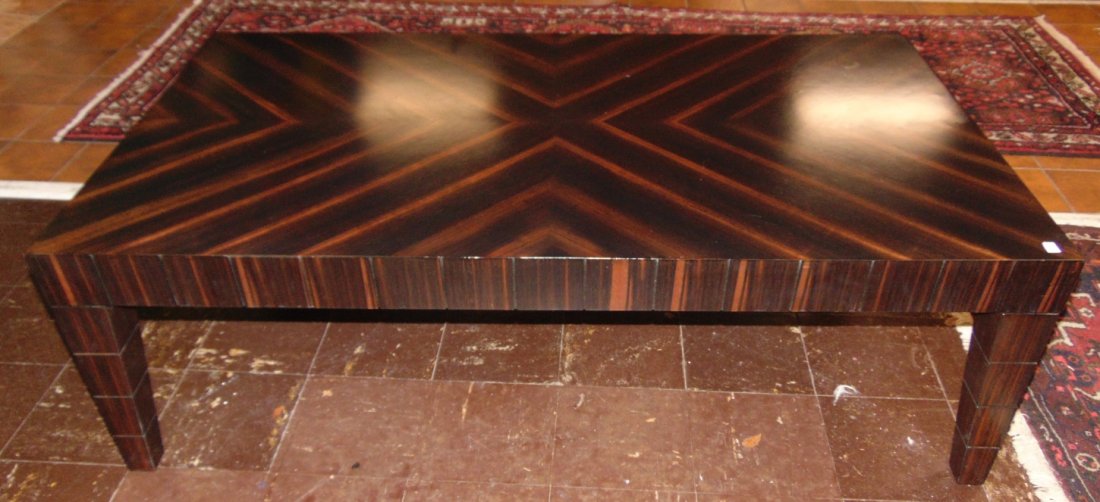 Marquetry Coffee Table: Contemporary Marquetry Coffee Table. Measures 54" wide x 30" deep x 17-1/2" tall. Condition is good with some minor wear. Several Shipping Options Available.