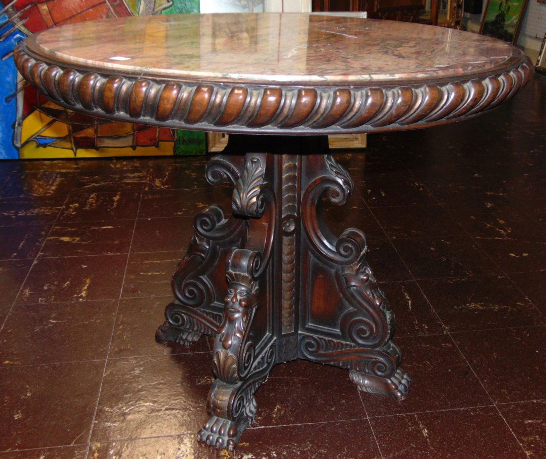 Antique Carved Walnut & Marble Top Table: Antique Carved Walnut & Marble Top Table. Measures 24" tall x 30" wide. Condition is very good with minimal wear. No damage. Several Shipping Options Available.