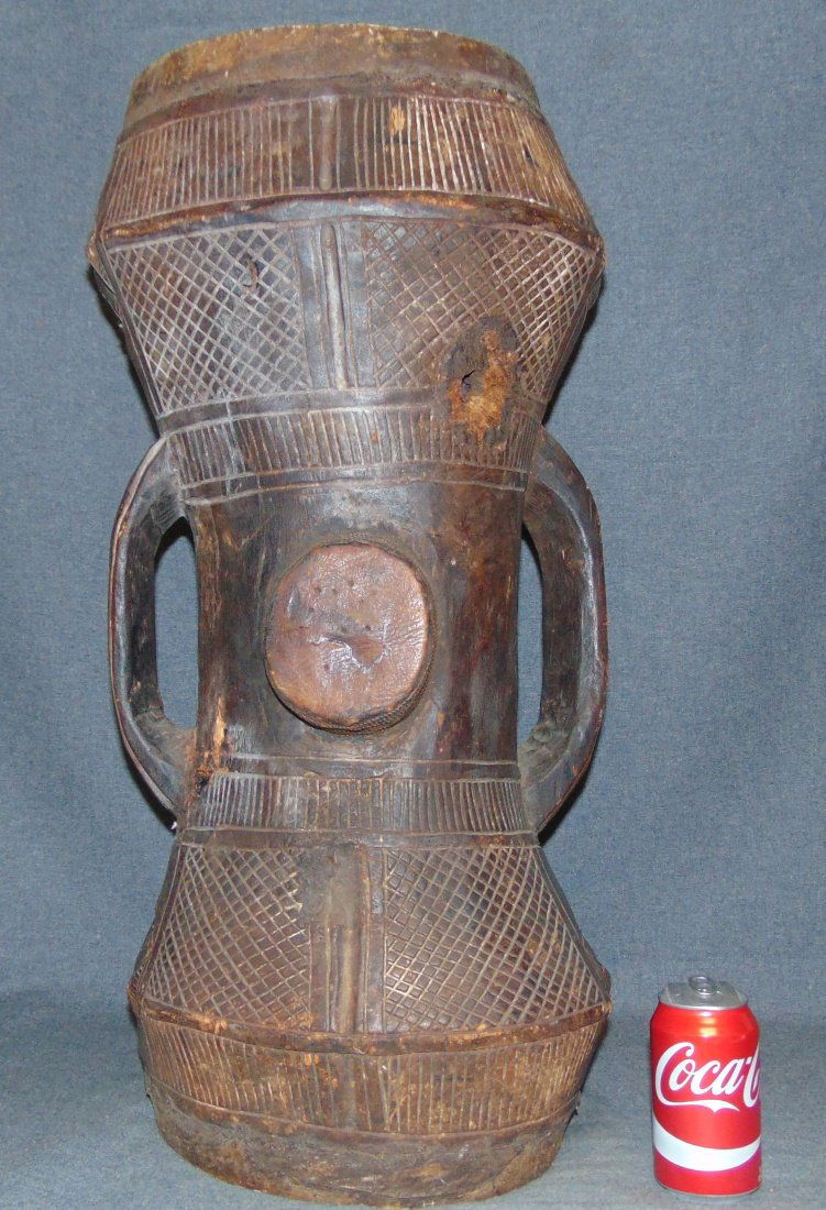 Songye Tribe Drum: Songye Tribe Drum. Authentic African Ceremonial Art. Measures 28" tall x 14" wide. Overall condition is good. Wear consistent with age. Several Shipping Options Available.