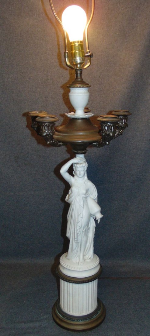 Vintage Bisque Porcelain Figural Table Lamp: Vintage Bisque Porcelain Figural Table Lamp. 5 Candelabra Arms. Figure stands 28" tall. Lamp measures 46" total to finial. Overall condition is good. Several Shipping Options Available.