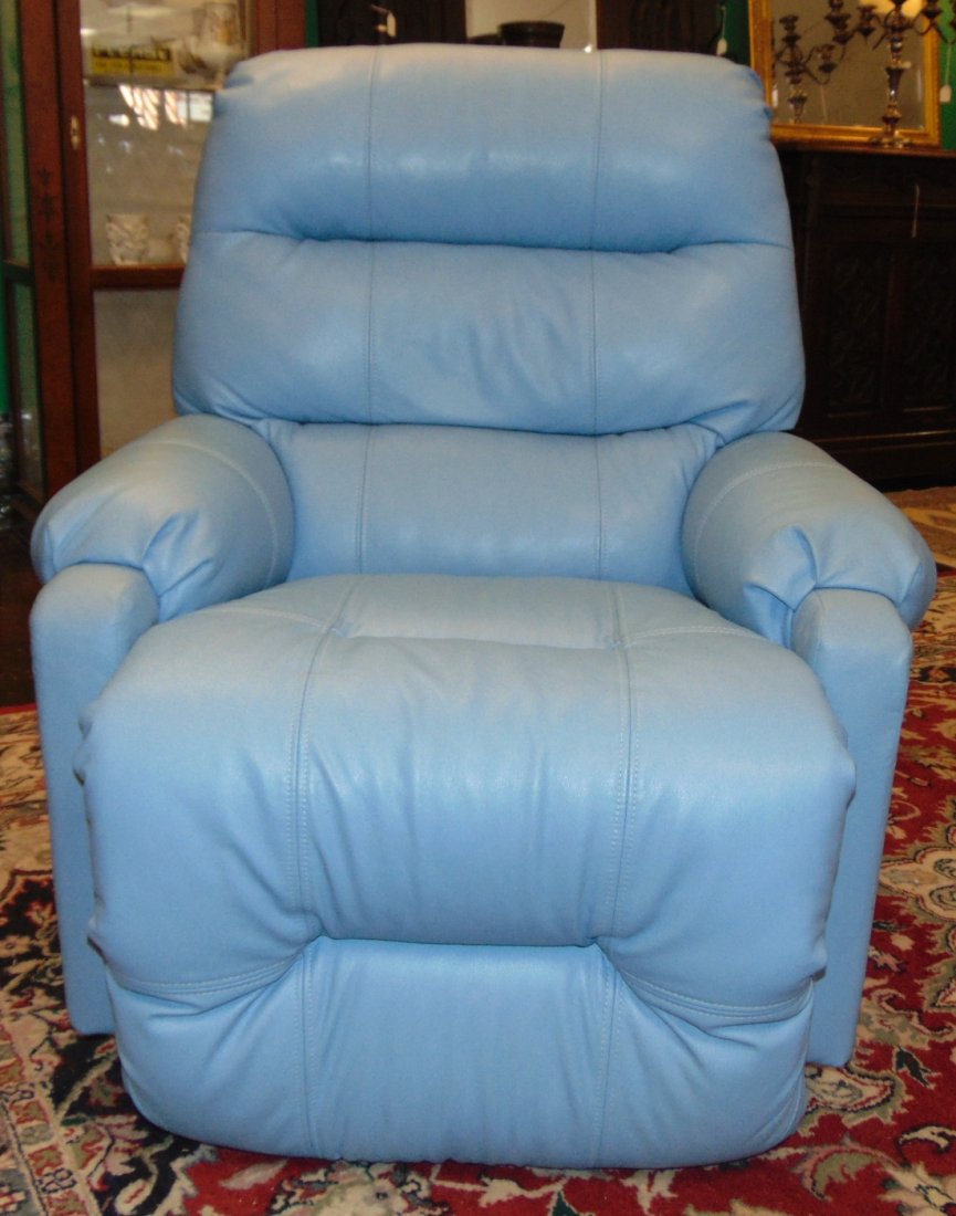 Like New Leather Recliner Chair: Like New, Blue Leather Recliner Chair. Measures 39" tall x 33" wide x 39" deep. Condition is Like New. Very good. No Damage. Several Shipping Options Available. Starting Bid $100. Auction Estimate $15