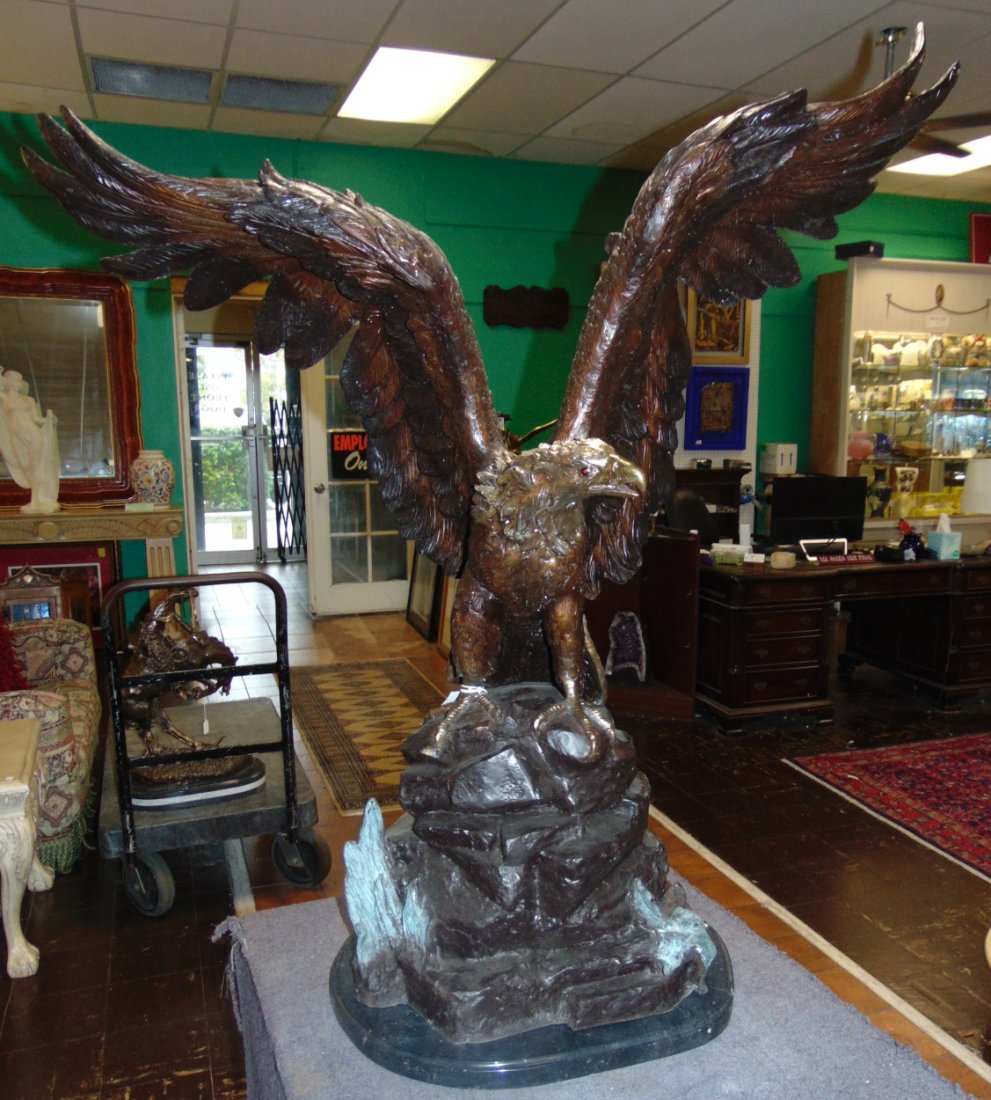 Life Size Bronze American Bald Eagle Sculpture: Life Size Bronze American Bald Eagle Sculpture on a Black Marble Base. Very heavy. Aprox 120-150 lbs. Excellent quality and detail with various shades of patina. Bronze may be used indoor or outdoor. 