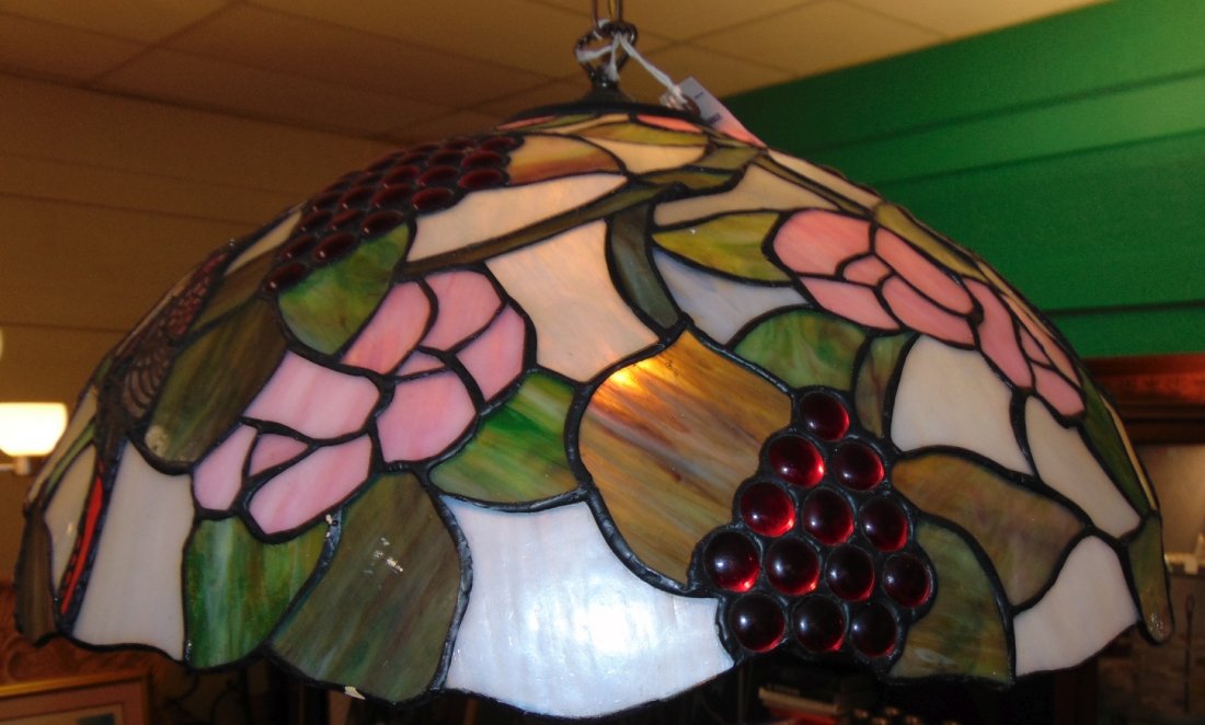 Tiffany Style Stained Glass Hanging Light Fixture: Tiffany Style Domed Stained Glass Hanging Light Fixture with Grapes and Blue Jays. Measures 21" wide x 11" tall. Single Light. Condition is very good with minimal wear. No damage. Several Shipping Opt
