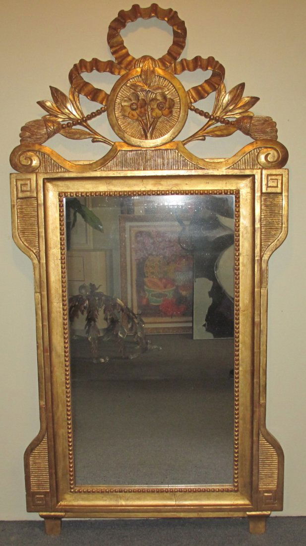 Gold Tone Carved Wood Mirror: Gold Tone Carved Wood Mirror. Measures 58" tall x 28" wide. Condition is good. No damage. Several Shipping Options Available.