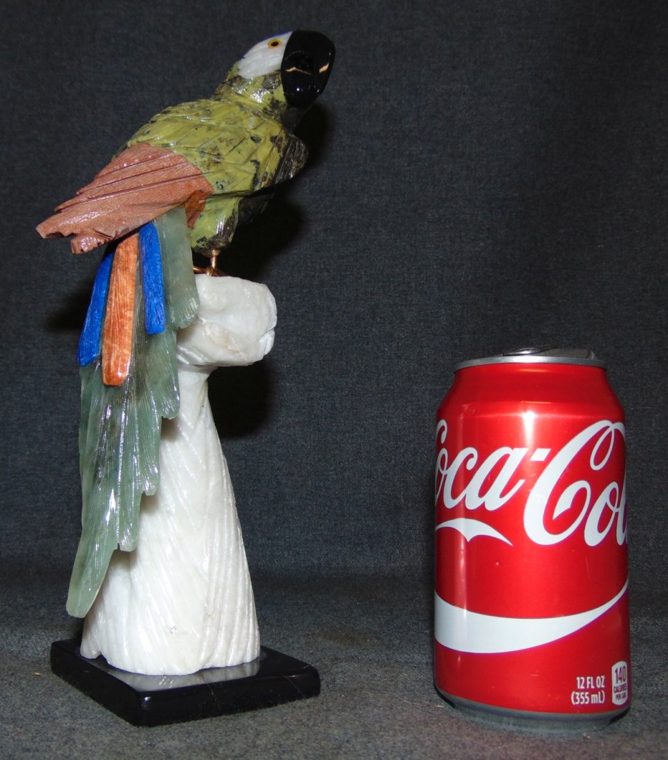 Hand Carved Semi-Precious Stone Macaw Sculpture: Hand Carved Semi-Precious Stone Macaw or Parrot Sculpture. Beautifully carved with semi precious stones on its tail and multi colored Jaspers. Measures 10-1/2" tall x 3-1/2" wide. Condition is Excelle