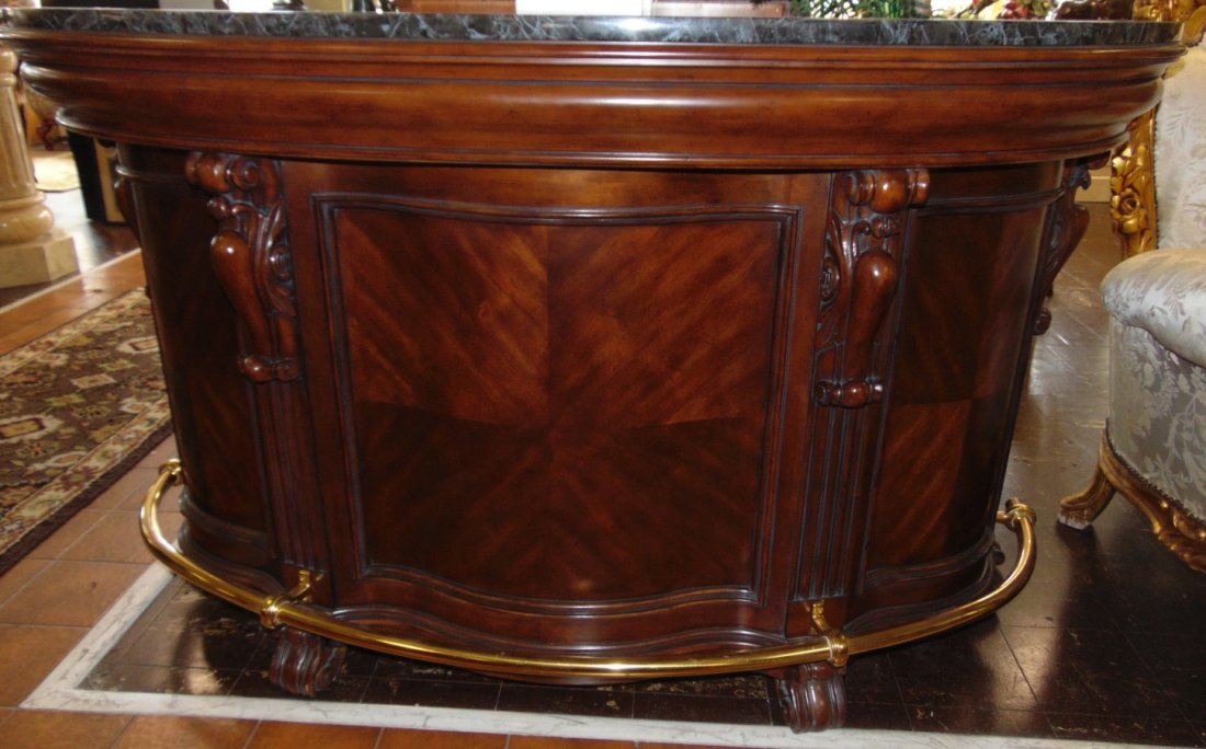 Mahogany Home Bar with Marble Top: Mahogany Home Bar with Marble Top and Brass Foot Rail. The top is a curved green marble top. The back side has three shelves for bottle storage and an exposed shelf. There are two Angle Drawers. Measu