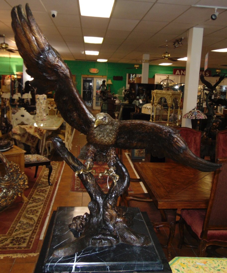 Bronze Eagle Sculpture on Marble: Beautiful and Large Bronze American Bald Eagle Sculpture on a Black Marble Base. Artist Signed. This Sculpture is made entirely from Bronze on a Marble base. Cast and crafted one piece at a time in th
