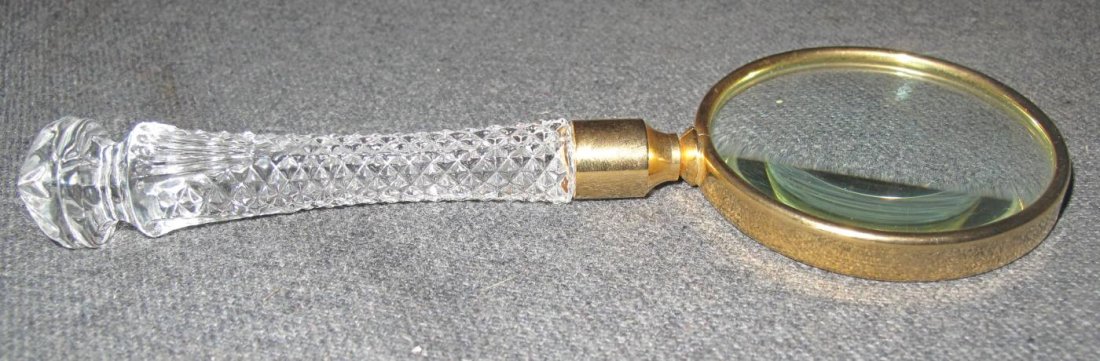 Waterford Crystal Magnifying Glass: Waterford Crystal and Brass Magnifying Glass. Measures 7-1/4" long x 2-3/4" wide. Good Condition. Several Shipping Options Available. Starting Bid $30.