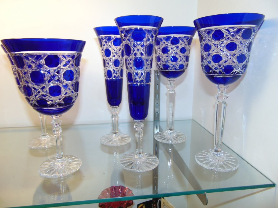 6 Cobalt Blue Crystal Wine, Water & Champagne Glasses: 6 Matching Cobalt Blue Cut to Clear Crystal Glasses. 2 Wine, 2 Champagne and 2 Water. Heavy and high quality European Leaded Crystal. Wine & Champagne glasses measure 9" tall each. Water is 7-3/4". Co