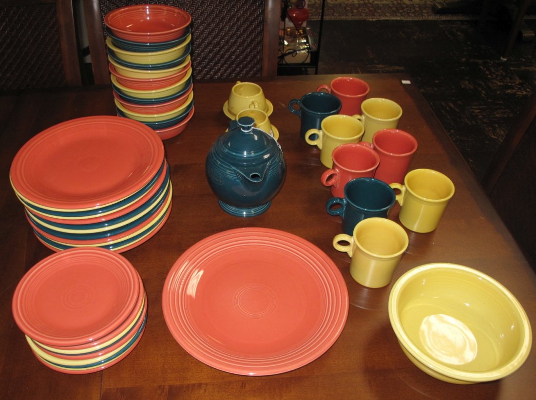 Lot of 49 pieces of Fiesta Dishware: Lot of 49 pieces of Fiesta Dishware. 3 Colors. Set includes: 13 Dinner Plates, 10 Small Plates, 12 Bowls, 9 Coffee Cups, 1 Large Platter, 1 Serving Bowl, a Tea Pot and a Cream & Sugar. Overall conditi