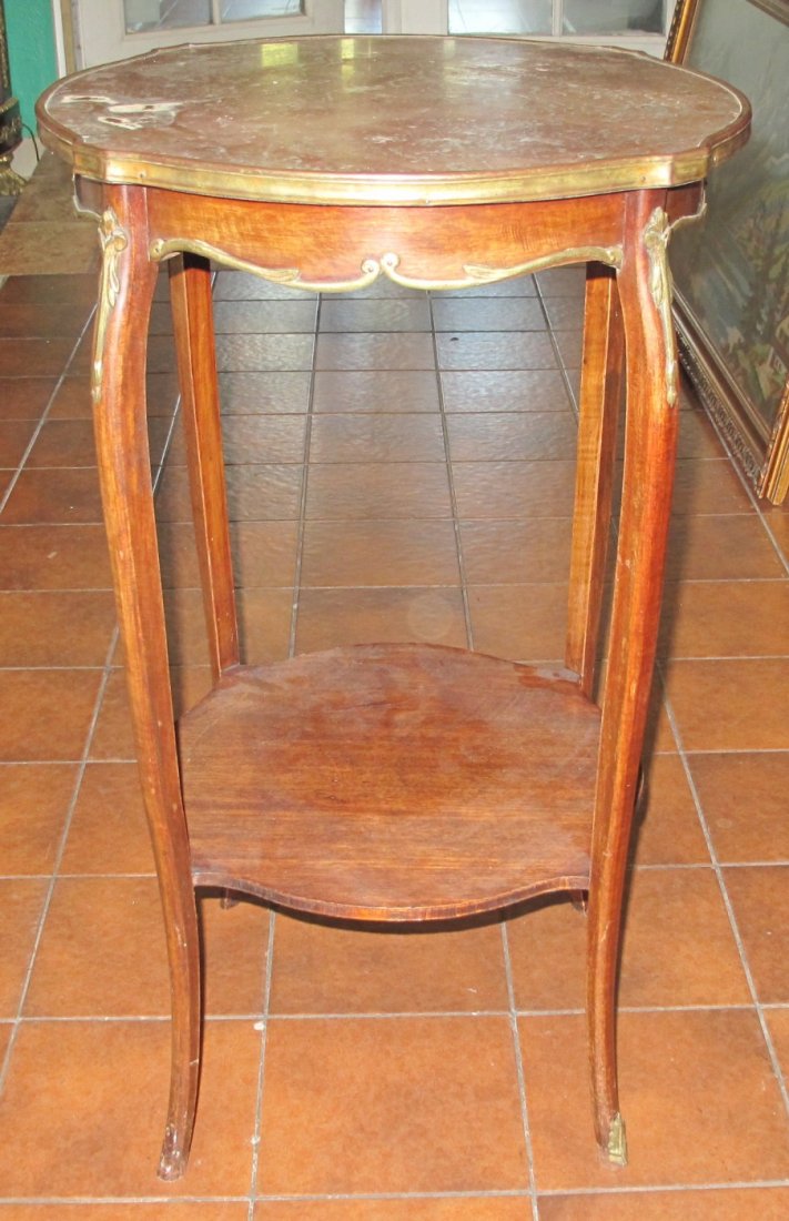 Antique Marble Top End Table: Antique Marble Top End Table with bronze mounts. Measures 29" tall x 18-1/2" wide x 18-1/2" deep. Overall condition is good. small crack in marble top (see close-up photo). Wear consistent with age an