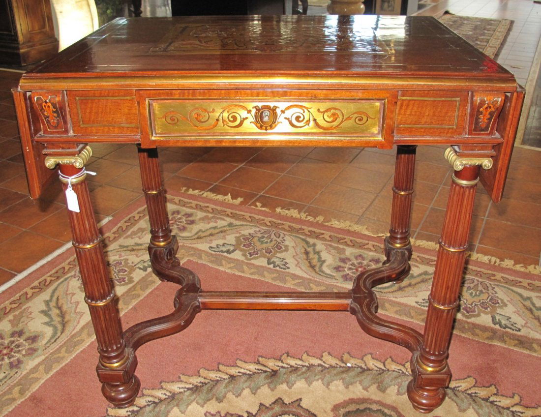 Napoleon III Style Bronze Inlaid Drop-Leaf Table: Napoleon III Style Bronze Inlaid Drop-Leaf Table. One drawer. Measures 30" tall x 31-1/2" wide x 22-1/2" deep. Top measures 44" wide with drop leaves up. Condition is Very good. No damage. Starting Bi
