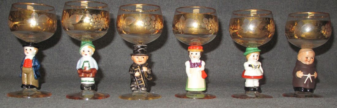 6 Goebel Figural Etched Wine Glasses: 6 Goebel Figural Etched Wine Glasses. Made in Germany. Each measures 5-3/4" tall and accented in 14k gold. Overall condition of each is good. No damage. Starting Bid $30 for all 6.