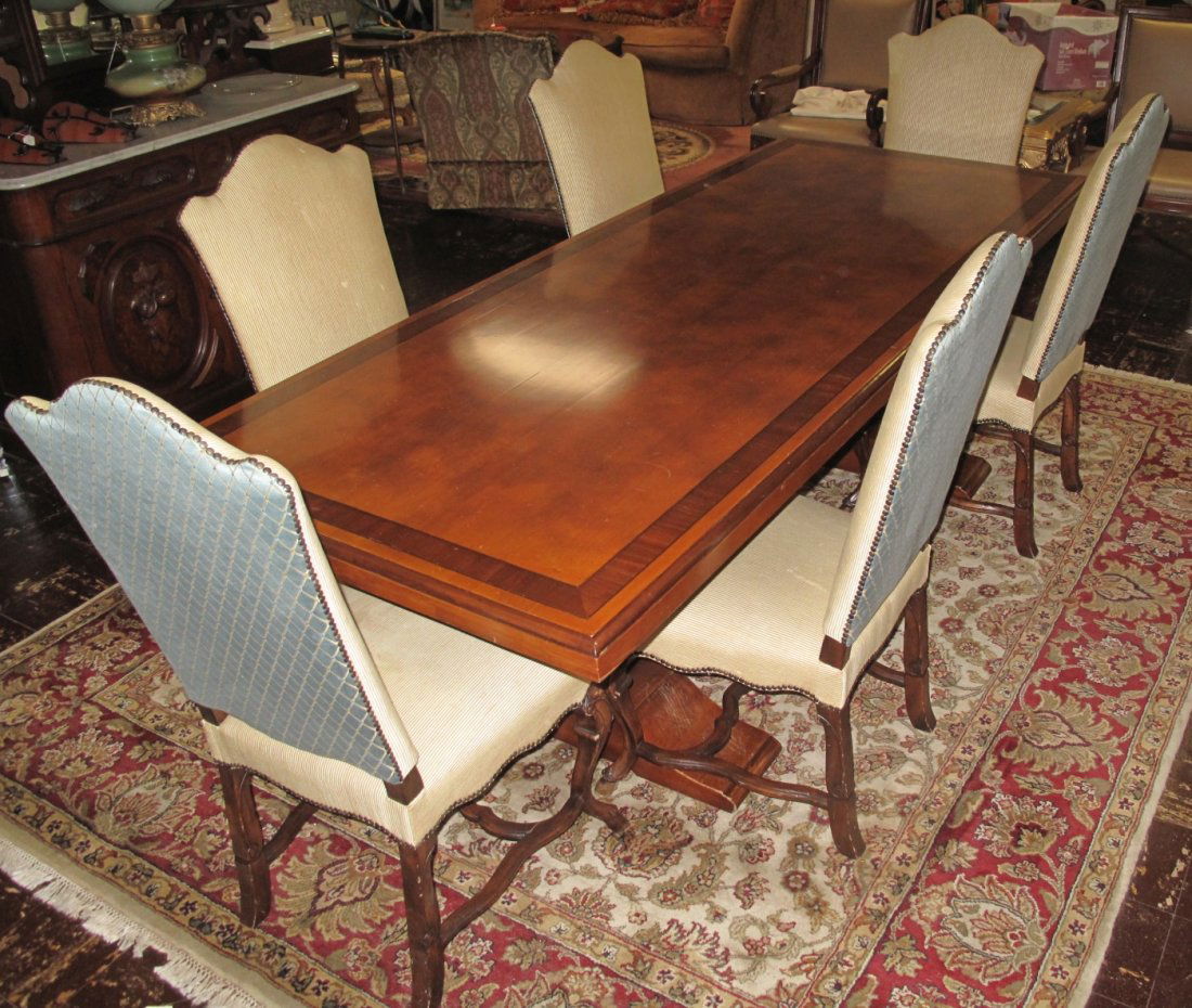 Trestle Dining Table and 6 Chairs: Trestle Dining Table with Inlaid Banded Top and 6 Upholstered Dining Chairs. Table measures 30" tall x 98" wide x 40" deep. Chairs are 45" tall x 21" wide x 22" deep. Condition is good. Some wear. No