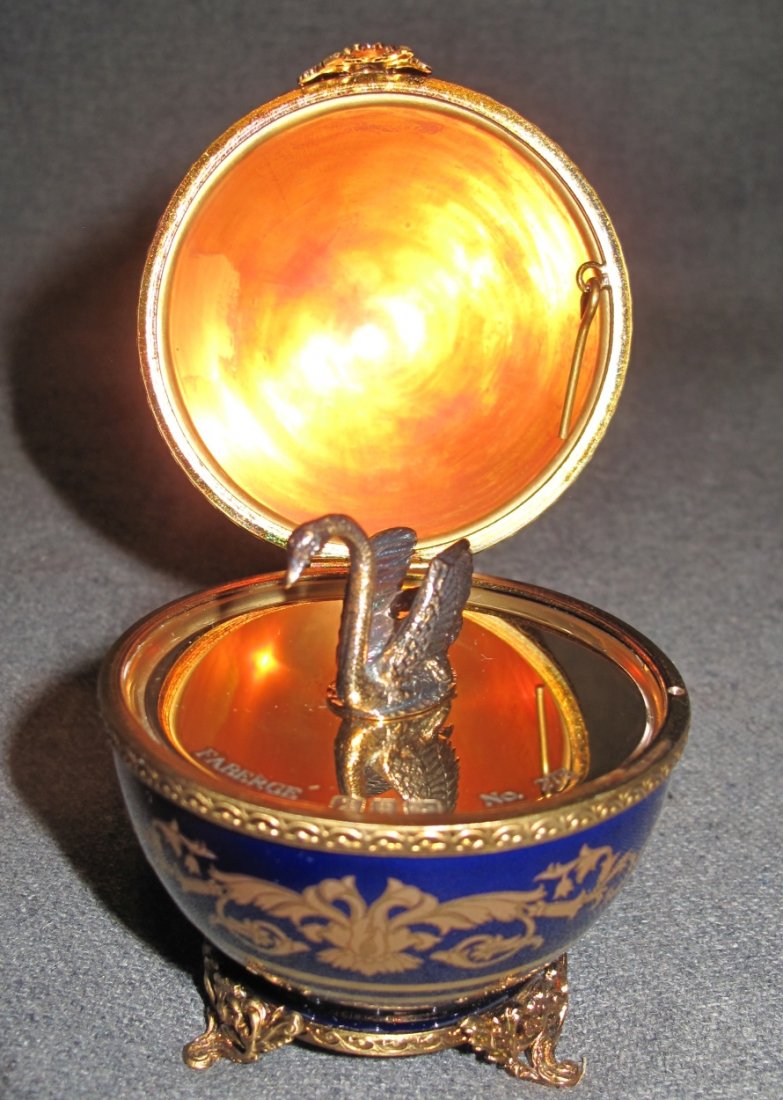 Faberge Imperial Swan Porcelain Egg: Faberge Imperial Swan Porcelain Egg. Limoges Cobalt Porcelain. Original numbered #275 of 800 Certificate included as well as fitted Gift Box. Properly hallmarked as well as signed Limoge on bottom. Me