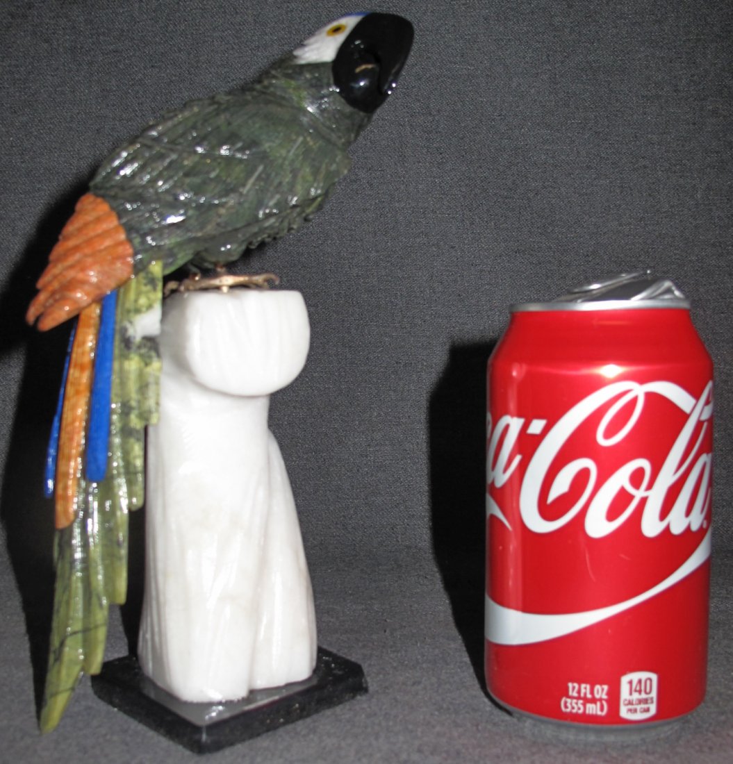 Hand Carved Semi-Precious Stone Macaw Sculpture: Hand Carved Semi-Precious Stone Macaw or Parrot Sculpture. Beautifully carved with semi precious stones on its tail and multi colored Jaspers. Measures 9-3/4" tall x 3-1/2" wide. Condition is Excellen