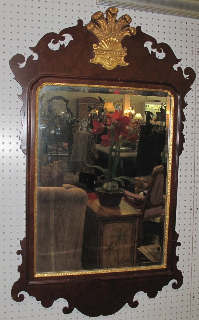 Antique Mahogany Wall Mirror: Antique Mahogany Wall Beveled Mirror. Measures 46" tall x 28-1/2" wide. Overall condition is good. Some molding losses (see close-up photos). Starting Bid $30.