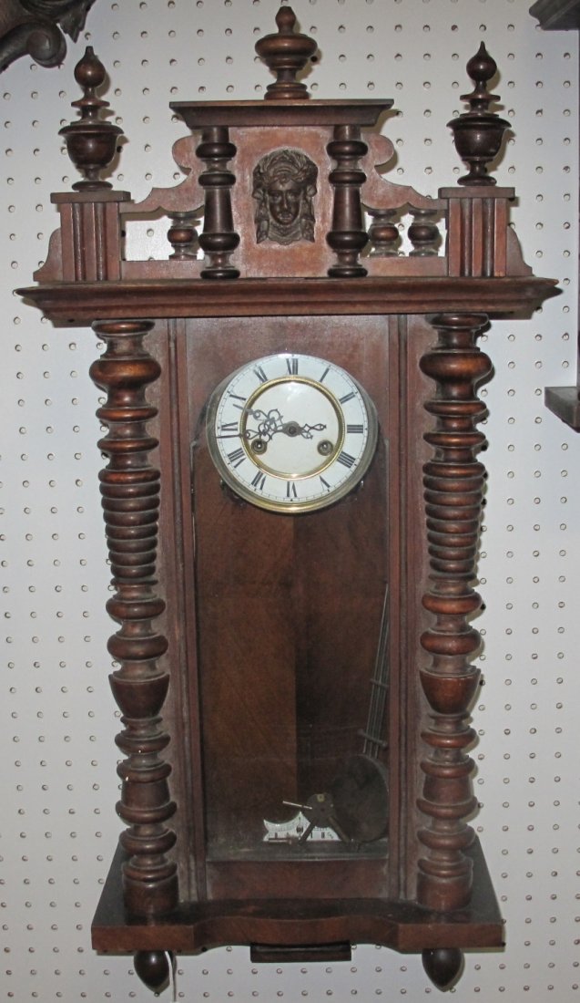 Antique Wall Clock: Antique Wall Clock. Measures 33-1/2" tall x 16-1/4" wide. Condition is good. Some Wear.