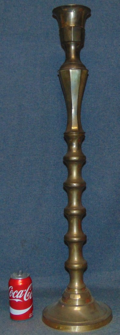 Gothic Brass Candlestick: Giant, Gothic Brass Candlestick. Measures 34-1/2" tall x 8-1/4" wide. Overall condition is good. Starting Bid $10.
