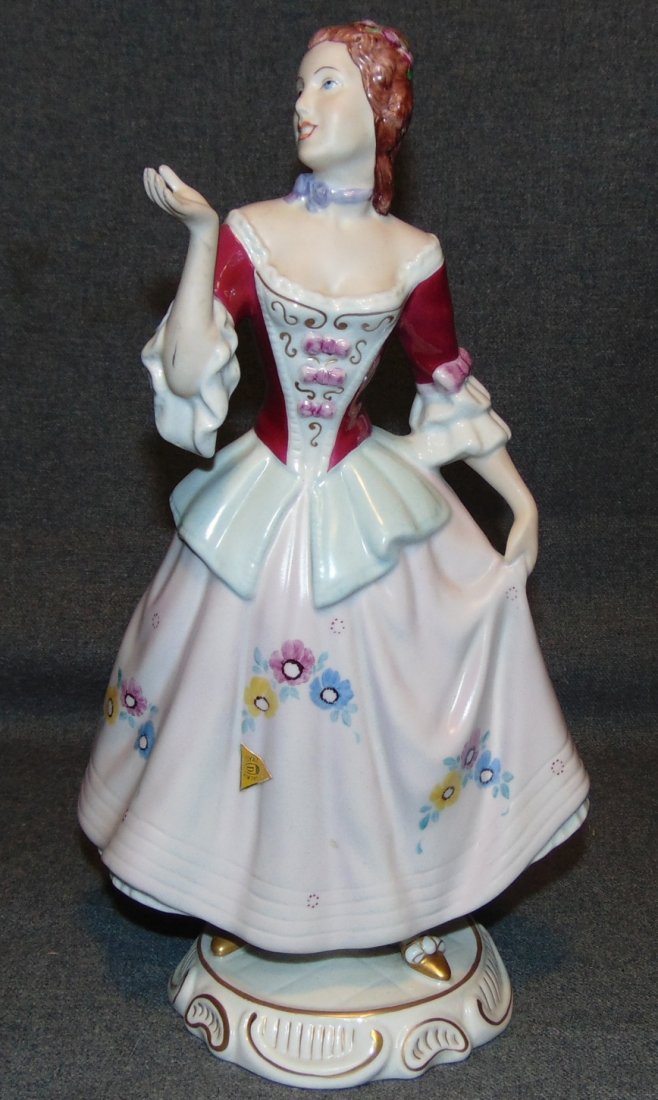 Royal Dux Figure by Elly Strobach Konig: Lovely Royal Dux porcelain figure by Elly Strobach König (Czechoslovakia 1908-2002). Measures 12-3/3" tall. Condition is very good with minimal wear. No damage. Bottom is marked.