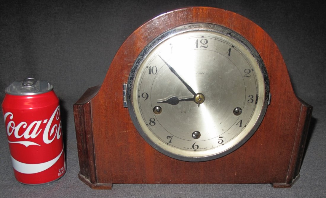 Antique Enfield Mantle Clock: Antique "Enfield" English Mantle Clock. Circa 1930's. Measures 8-3/4" tall x 12" wide x 4-1/2" deep. Condition is good to fair. Some Wear. Starting Bid $40.