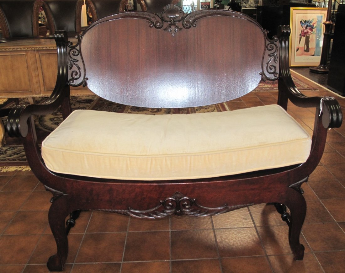 Antique Mahogany Settee: Antique Mahogany Settee. Measures 35-1/2" tall x 42" wide x 28" deep. Condition is good. Some wear and surface scratches.
