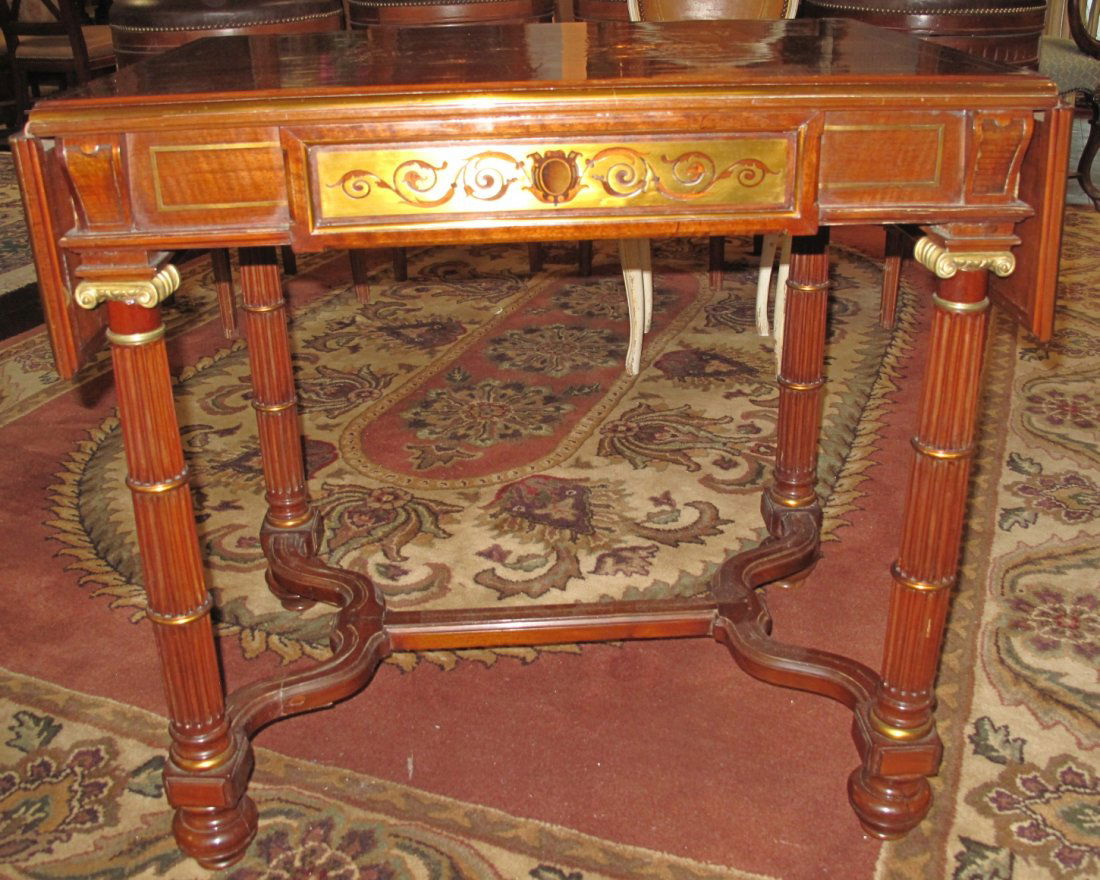 Napoleon III Style Bronze Inlaid Drop-Leaf Table: Napoleon III Style Bronze Inlaid Drop-Leaf Table. One drawer. Measures 30" tall x 31-1/2" wide x 22-1/2" deep. Top measures 44" wide with drop leaves up. Condition is Very good. No damage.
