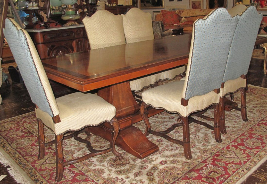 Trestle Dining Table and 6 Chairs: Trestle Dining Table with Inlaid Banded Top and 6 Upholstered Dining Chairs. Table measures 30" tall x 98" wide x 40" deep. Chairs are 45" tall x 21" wide x 22" deep. Condition is good. Some wear. No