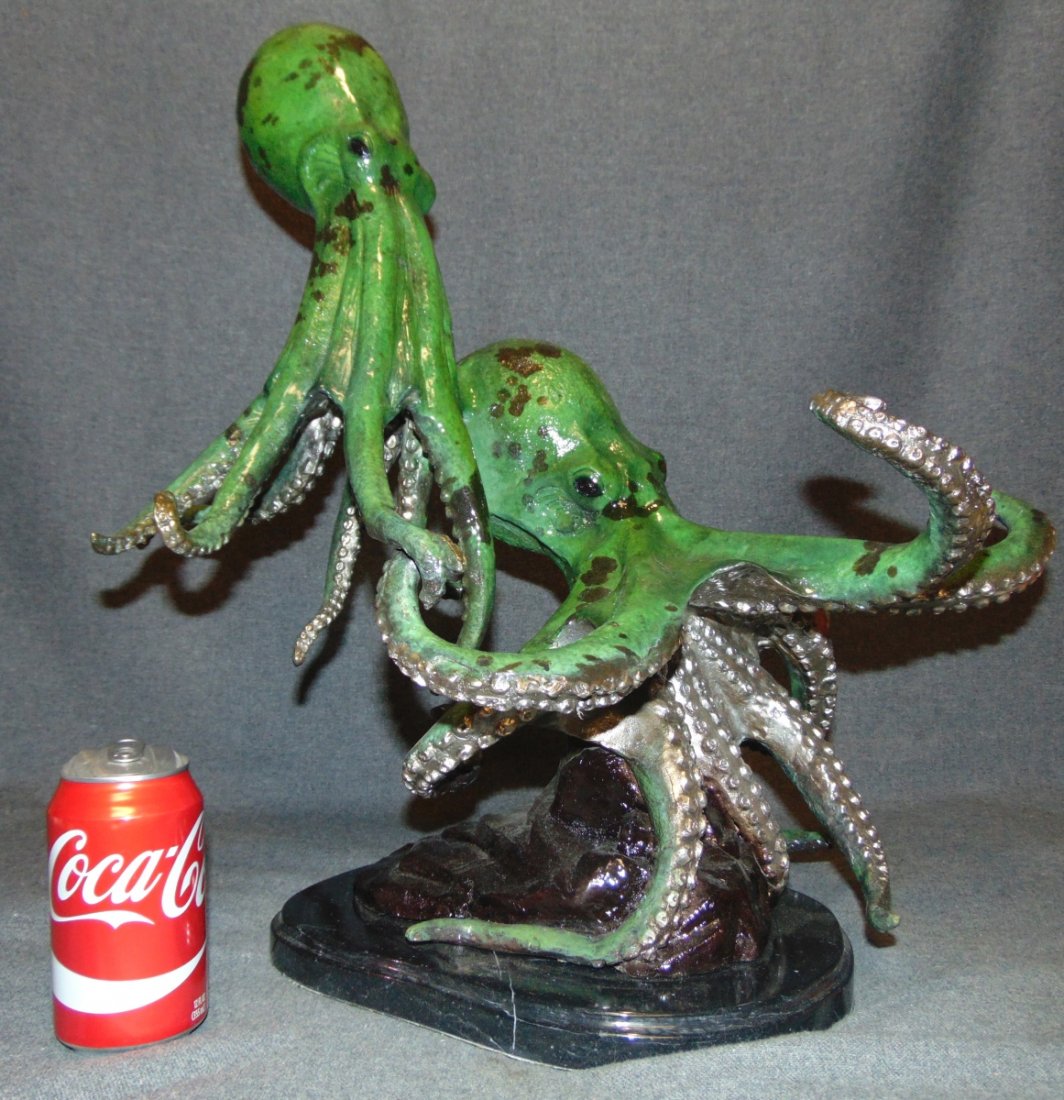 Bronze Double Octopus Sculpture on Marble Base: Bronze Double Octopus Sculpture on a Black Marble Base. Artist Signed and Numbered 32 of 50. Measures 20" tall x 17" wide x 15" deep. Condition is New, Mint. No Damage.