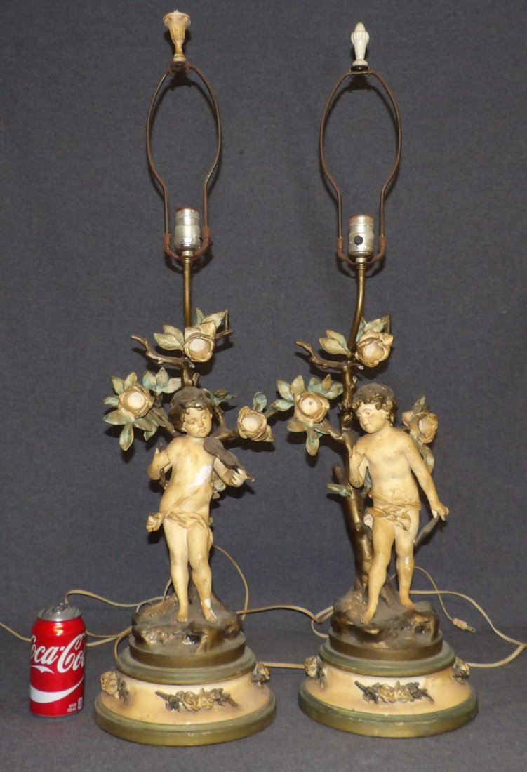 PAIR of ANTIQUE FIGURAL LAMPS: Pair of Antique Spelter Figural Lamps. No shades. Each measures 36" tall x 9-1/2" wide. Condition is fair. Some wear to finish. Paint losses. Starting Bid $50. Auction Estimate $120 - $150.