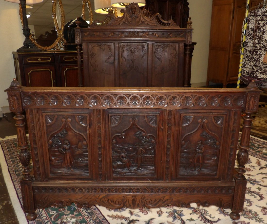 ANTIQUE ITALIAN CARVED OAK BED: Antique Carved Oak Bed from Italy. Measures 61-1/2" tall x 58" wide x 80" deep. Condition is good. Minimal wear. No damage. Starting Bid $350. Auction Estimate $750 - $1,200.