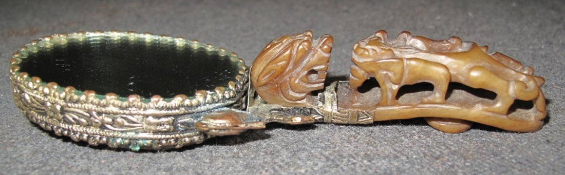 ANTIQUE CHINESE JADE BELT HOOK MIRROR: Antique Chinese Jade Dragon Belt Hook Hand Mirror. Measures 5-1/4" X 1-3/4". Condition is Very good. No damage. Starting Bid $50.