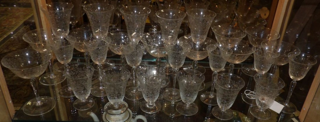 LOT of 28 VINTAGE ETCHED GLASSES: Set of 28 Vintage Etched Stemware Glasses. Includes: 6 Water, 7 Cordial, 10 Champagne Coups and 5 Wine Glasses. Overall condition is very good. No damage. Starting Bid $50. Auction Estimate $80 - $150