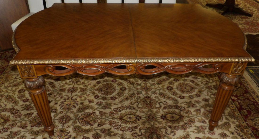CARVED DINING TABLE: Carved Wood Dining Table. Measures 30" tall x 72" long x 44-1/2" wide without leaf insert. Leaf is an additional 18". Overall condition is very good. No damage. Starting Bid $250. Auction Estimate $50