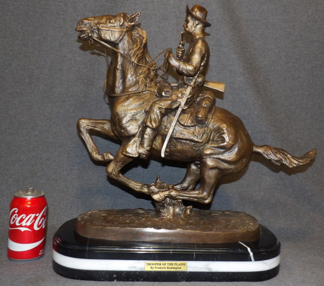 BRONZE TROOPER of the PLAINS after FREDERICK REMINGTON: Western Bronze Sculpture "Trooper of the Plains" after Frederick Remington on a Triple Marble Base. Signed. Measures 20" tall x 20" wide x 8" deep. Overall condition is Excellent. No Damage. Starting 