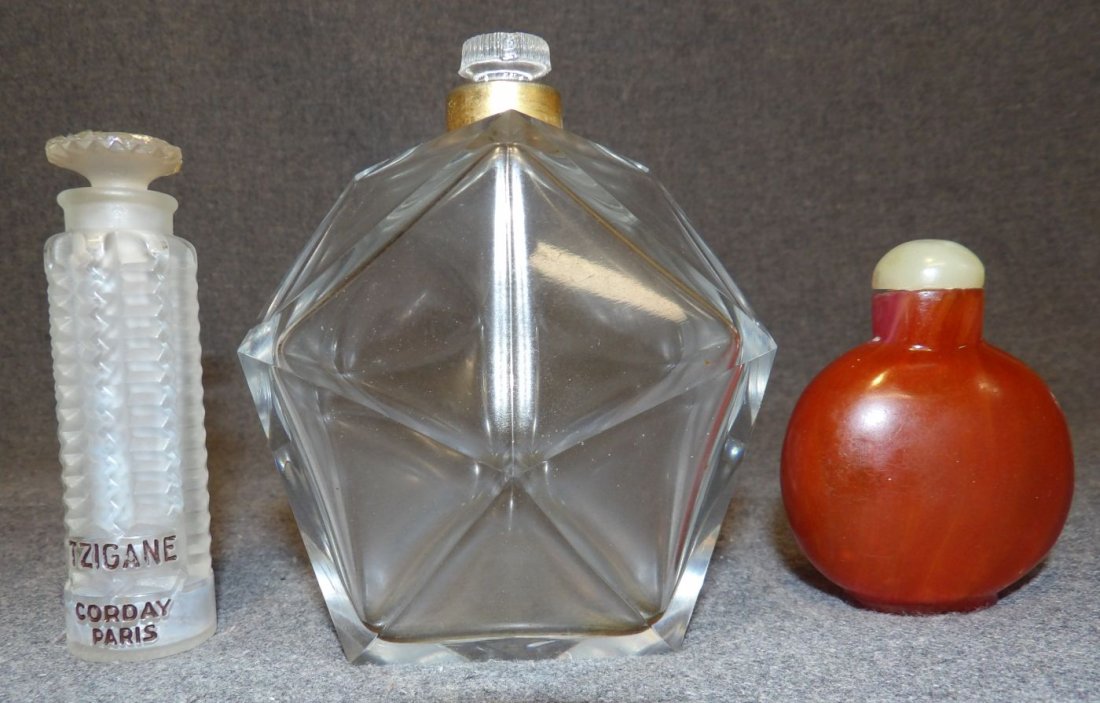 3 VINTAGE CUT GLASS PERFUME BOTTLES: 3 Vintage Cut Glass Perfume Bottles including Baccarat & Lalique. Condition is good. Starting Bid $80. Auction Estimate $100 - $300.