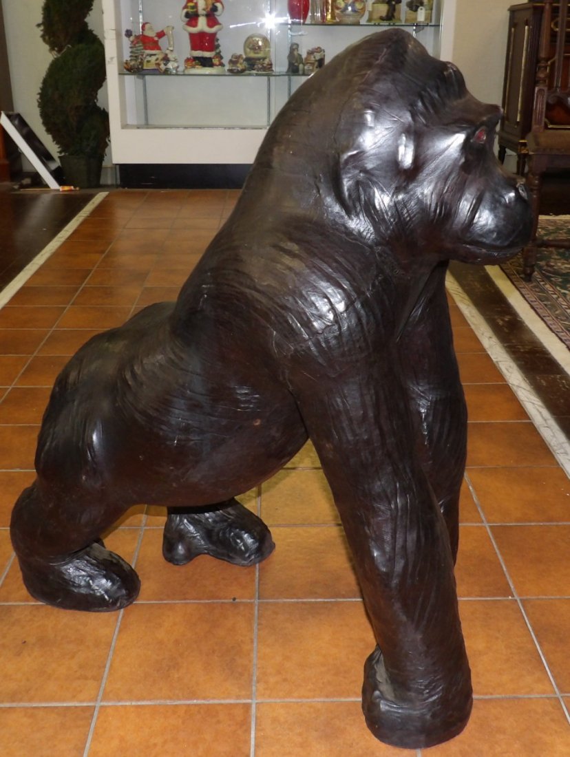 LARGE HANDMADE LEATHER GORILLA SCULPTURE: Large, Handmade Leather Gorilla Sculpture. Measures 33" tall x 16" wide x 27" deep. Condition is Very good. No damage. Starting Bid $100. Auction Estimate $250 - $400.